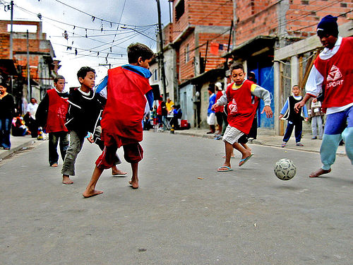 Children Playing Football In The Street